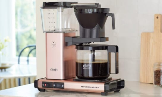 Rose gold coffee maker with brewer on