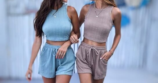 women wearing light blue and tan crop tops and shorts sets