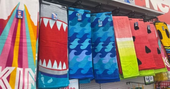 Five below beach towels hanging up at the store