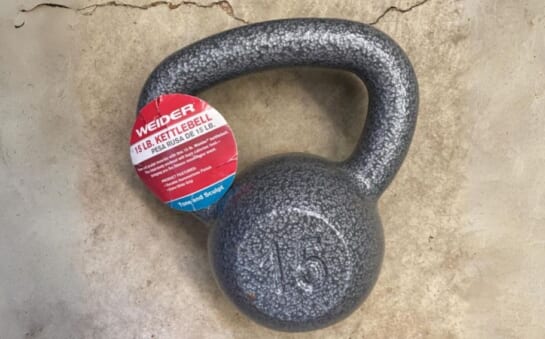 a 15 pound kettlebell laying on a concrete floor